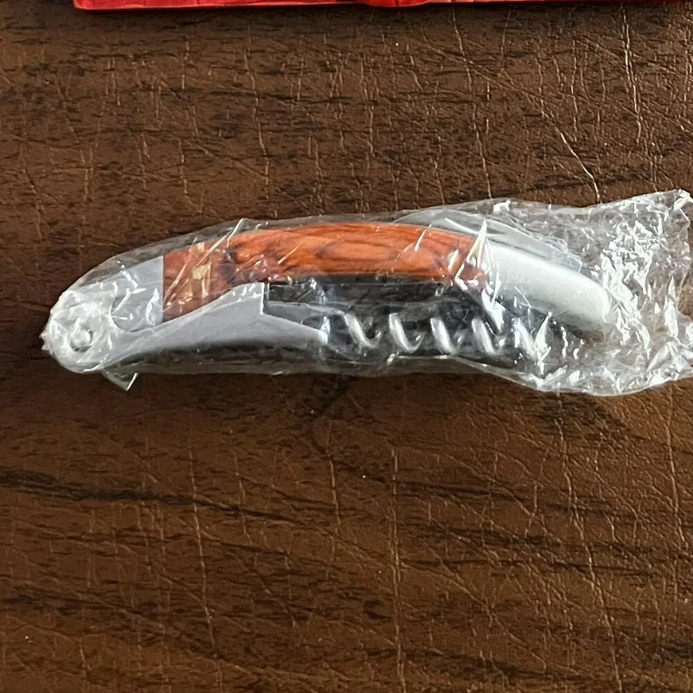 NIB Neiman Marcus Corkscrew and Bottle Opener in Red Leather Case